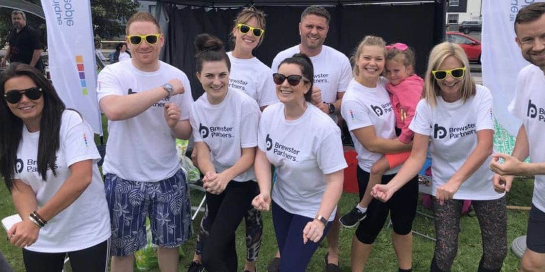Brewster Partners come 6th in annual Dragon Boat Race