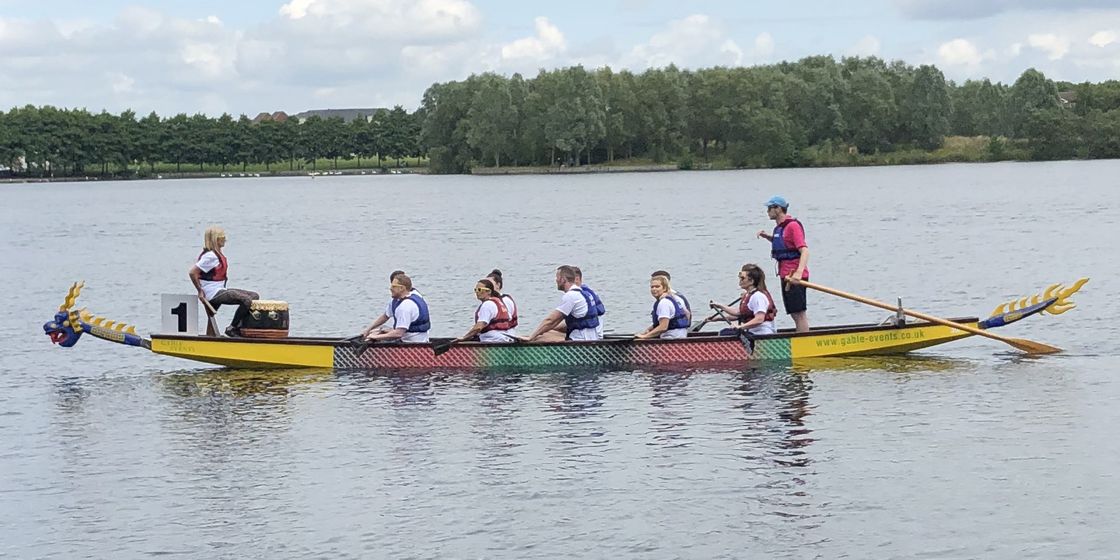 Brewster Partners come 6th in annual Dragon Boat Race